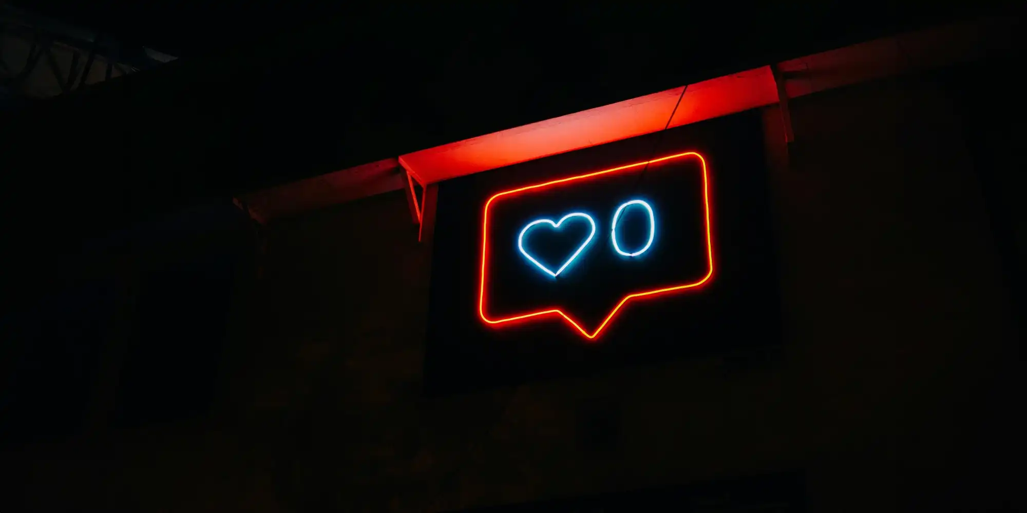 a neon sign shows 0 likes, a symbol for being ignored on social media